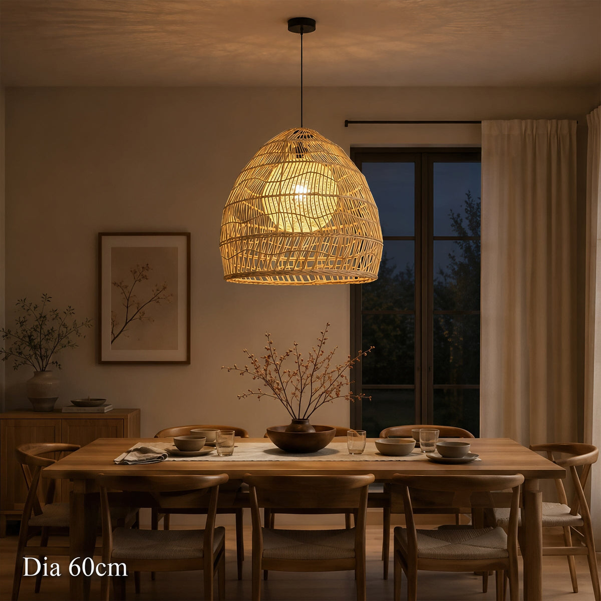 60cm rattan pendant light glowing above a dining table at dusk