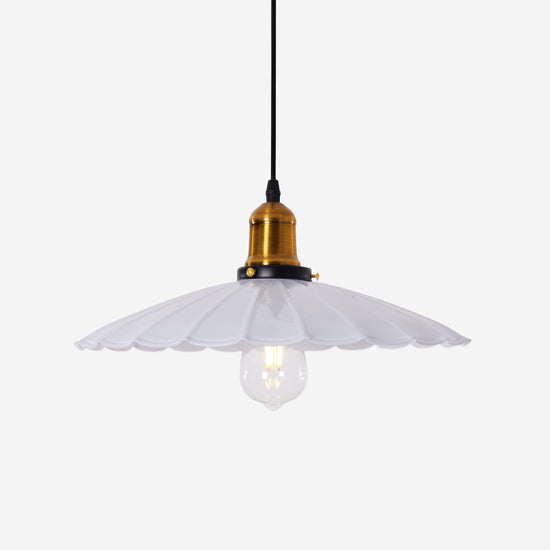 white iron pendant light hung above a dining table