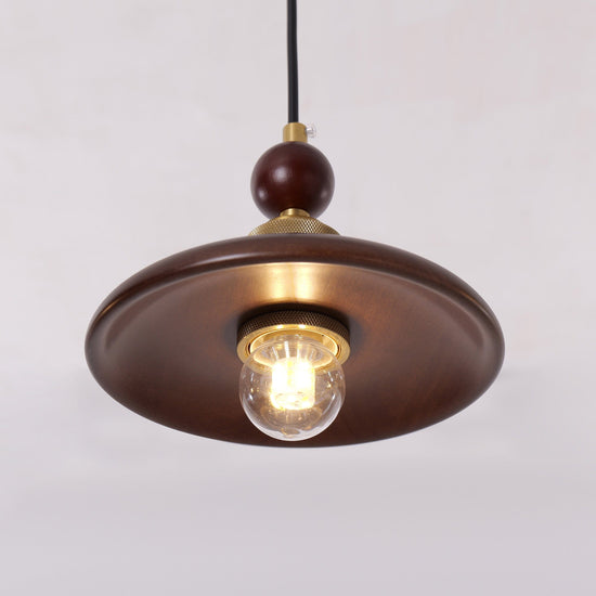 3-light walnut wood mini pendant over a kitchen island