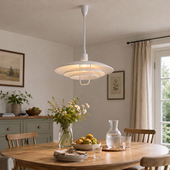 white layered minimalist pendant light styled in a calm bedroom