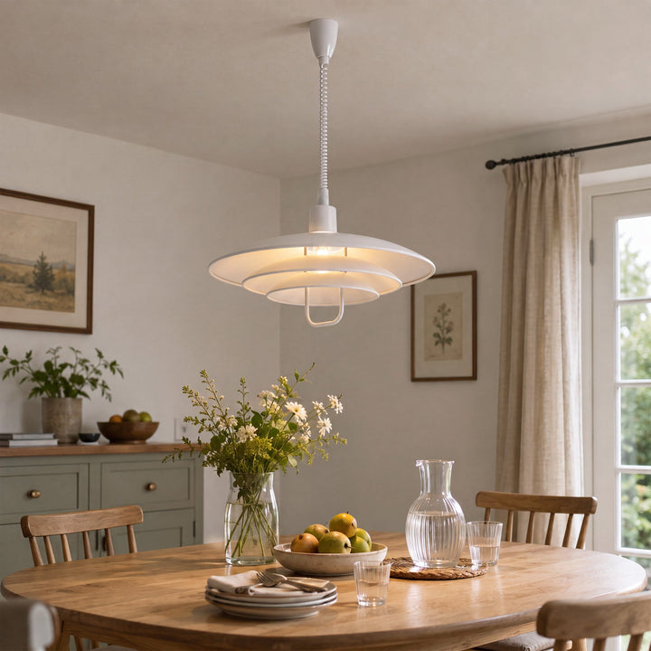 white layered minimalist pendant light styled in a calm bedroom