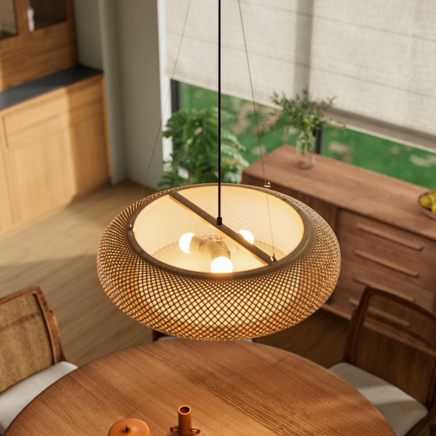 top view of bamboo pendant light above a wood table