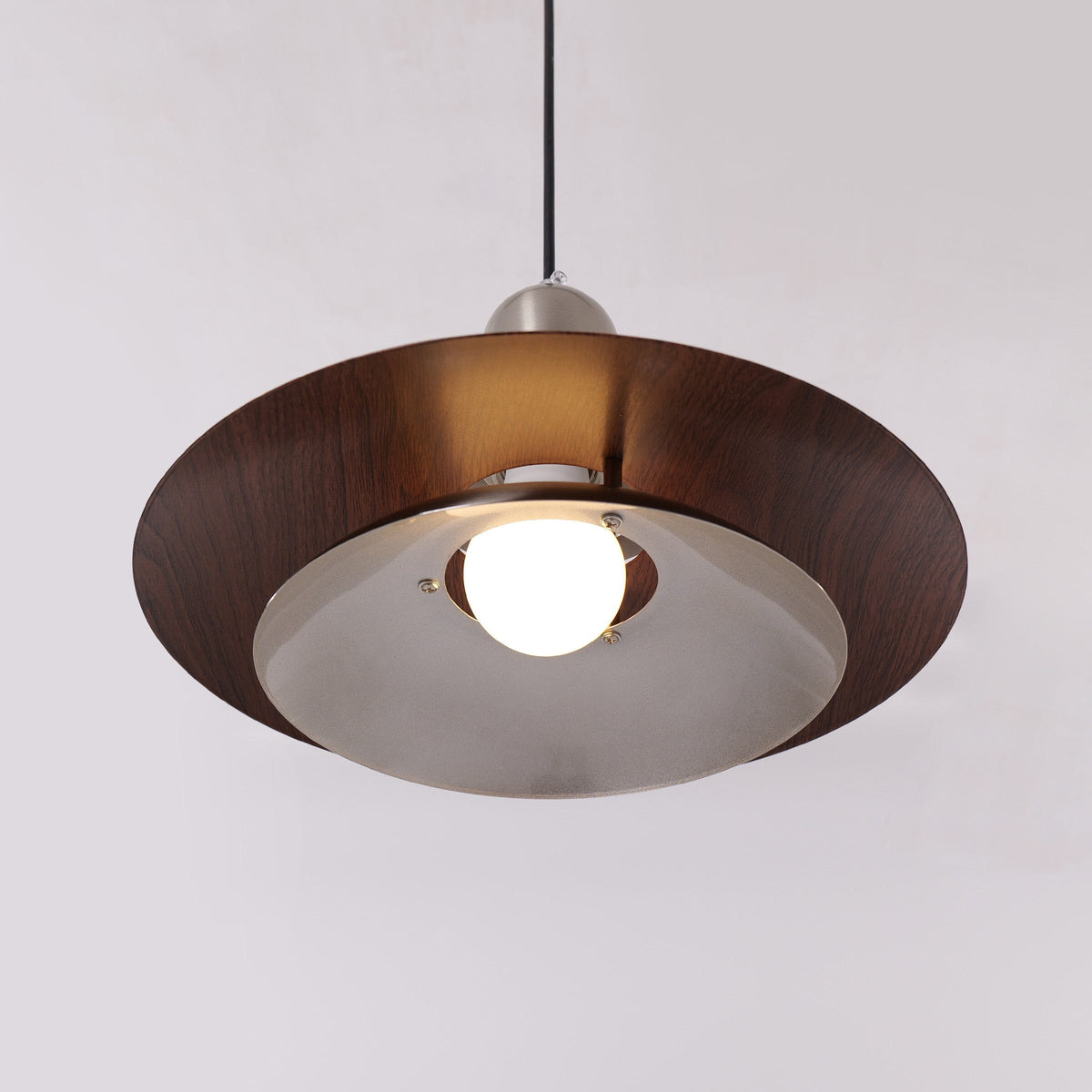 3-light walnut iron bar pendant styled in a calm bedroom