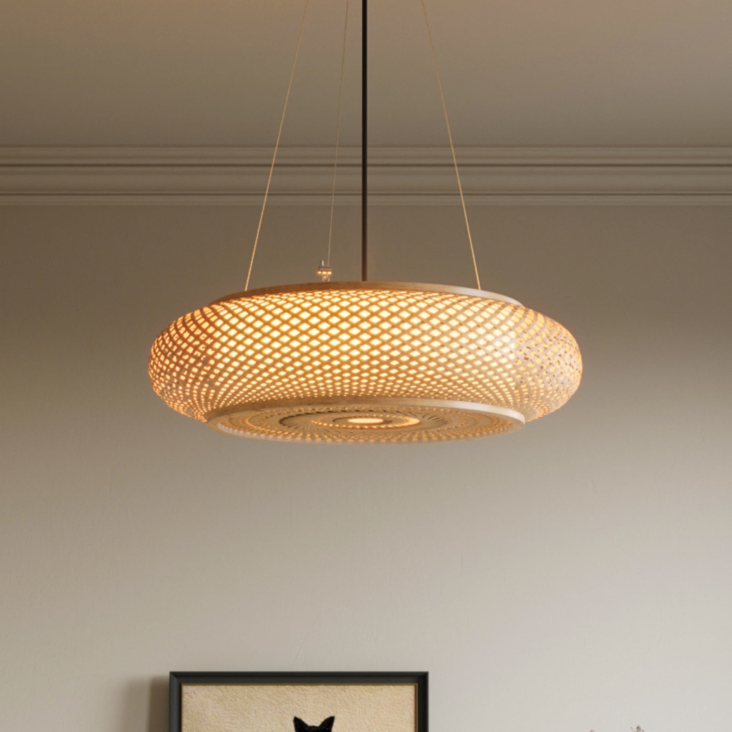 warm bamboo pendant light hanging in a living room