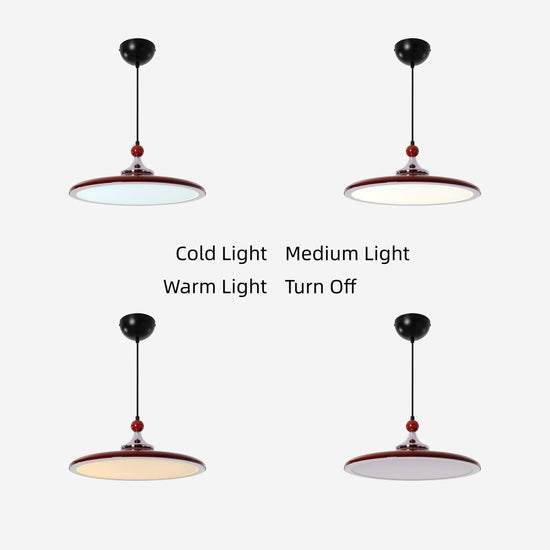 red iron pendant light over a kitchen island