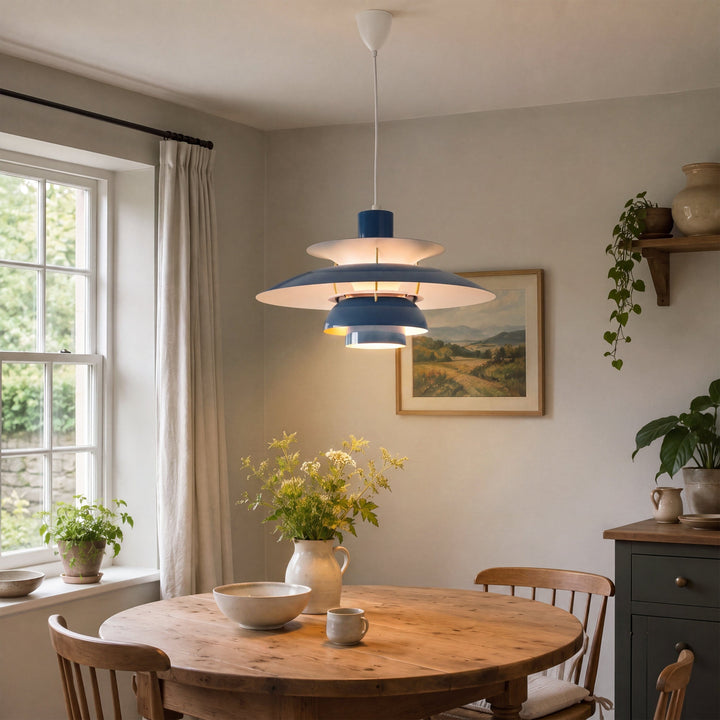 blue layered minimalist pendant light styled in a calm bedroom