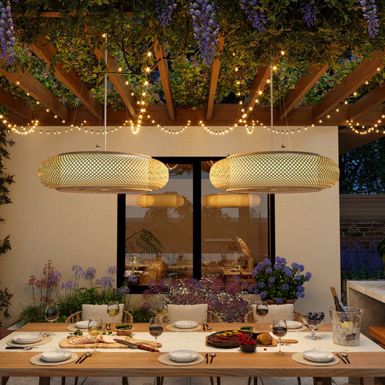 pair of bamboo pendant lights above a covered patio table