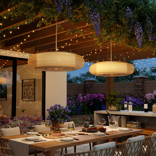 bamboo pendant lights over a patio dining table at night