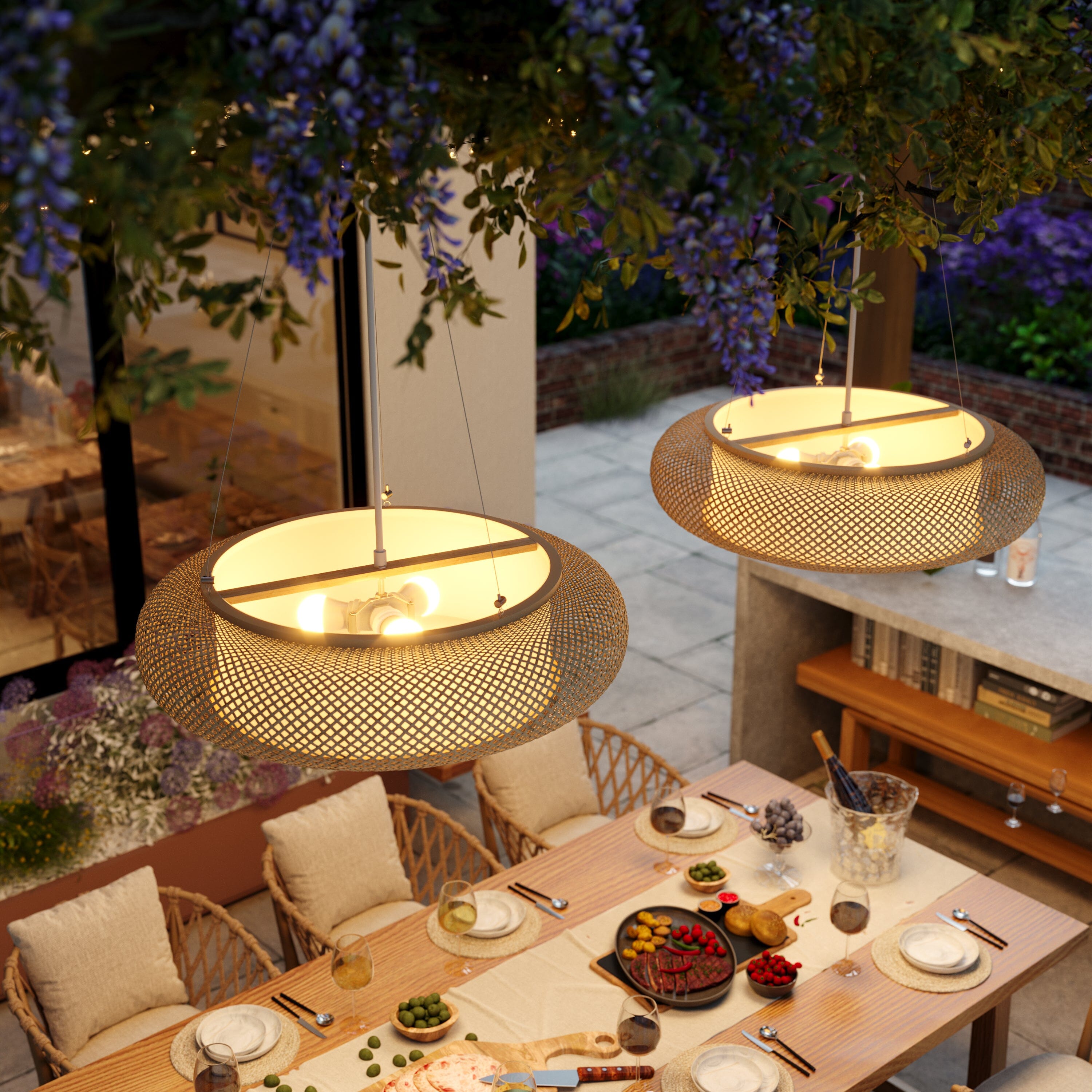 overhead bamboo pendant lights above an outdoor dining table