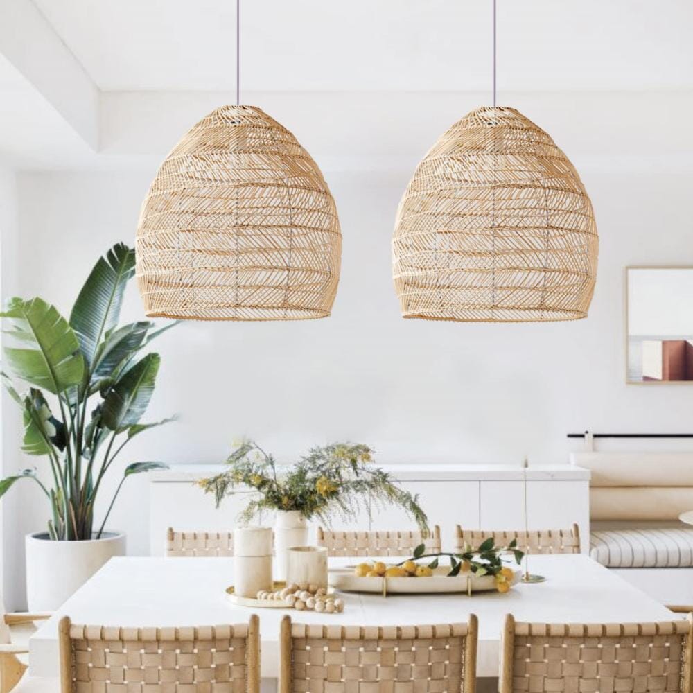 Two natural rattan pendant lights above a light dining table