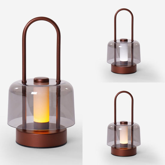 portable lantern-style ambient table lamp adding warm light to a bedroom