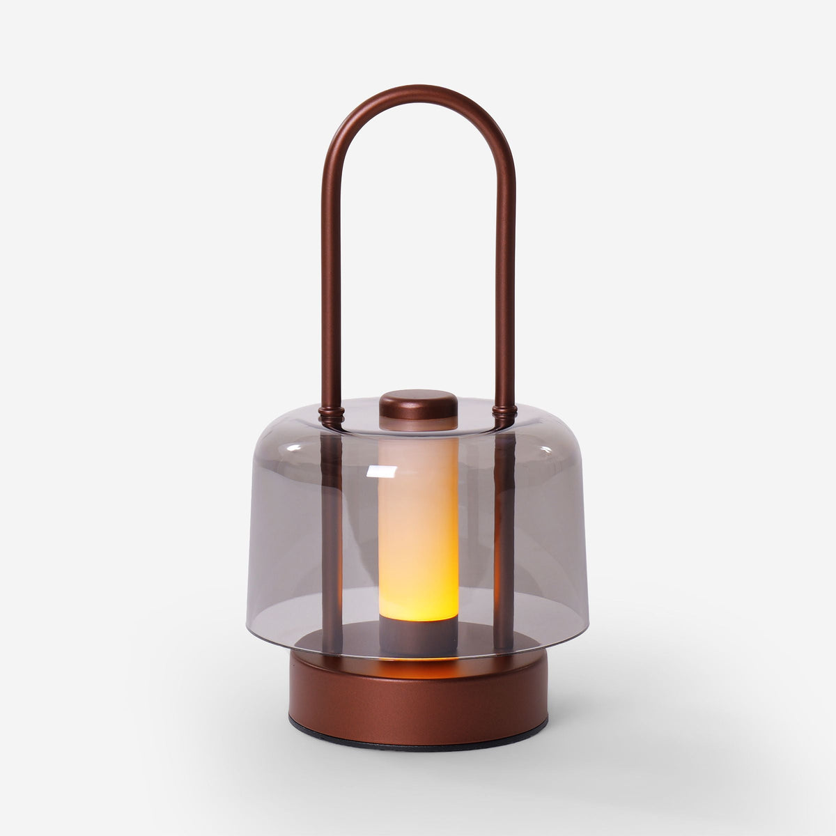 portable lantern-style ambient table lamp beside books and evening decor