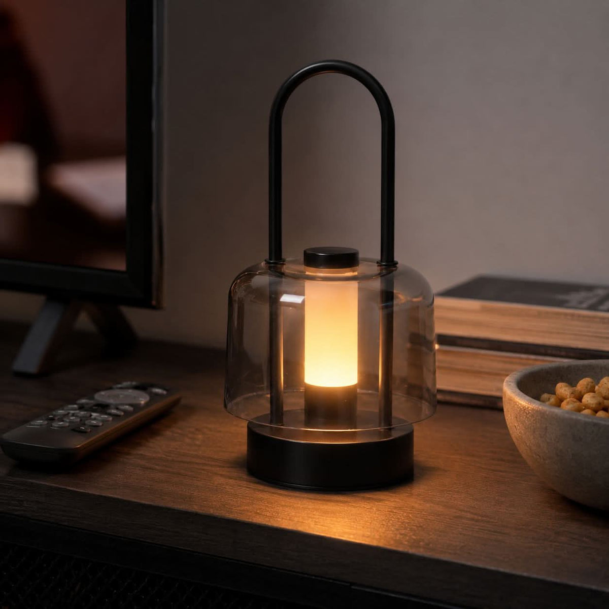 portable lantern-style ambient table lamp beside books and evening decor