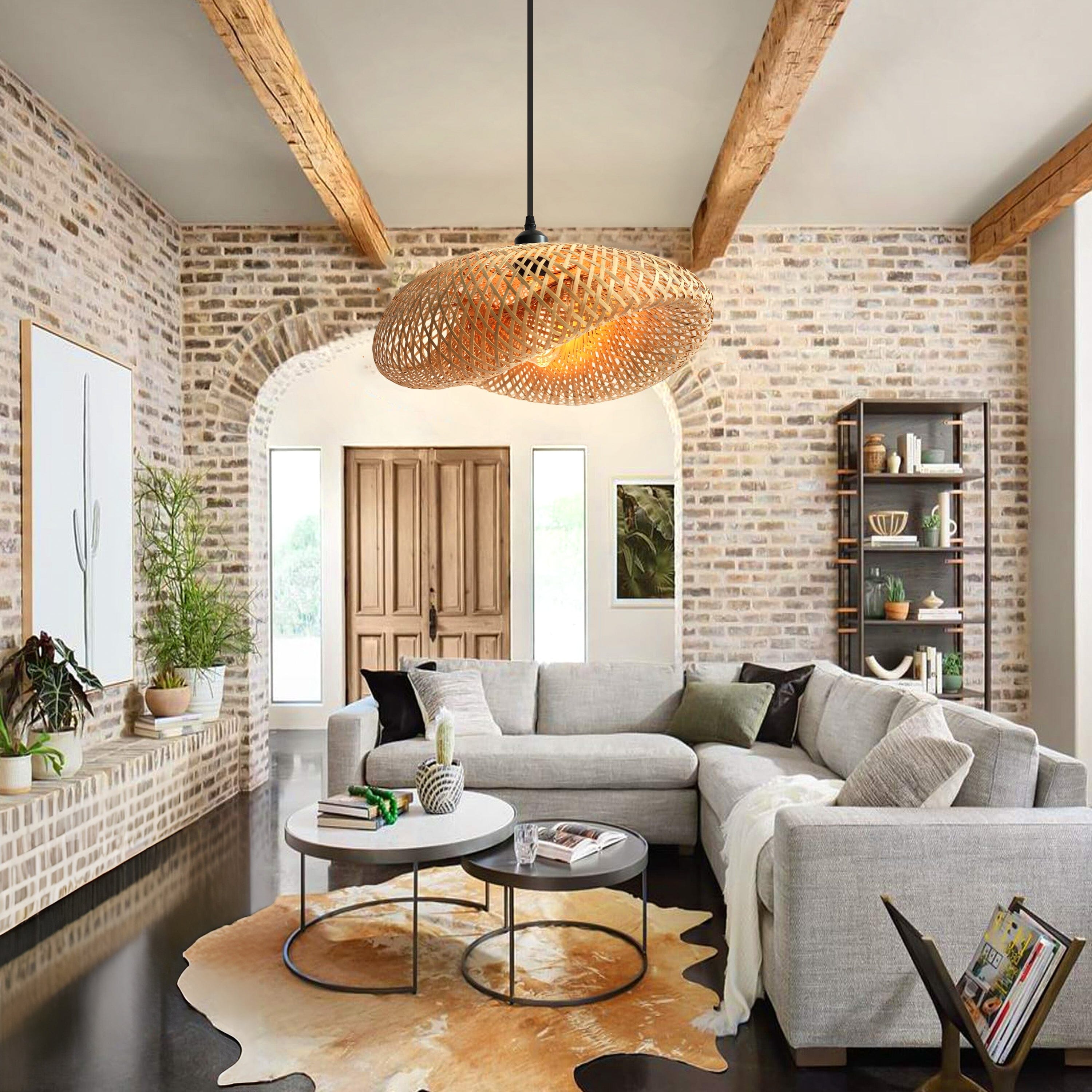 bamboo pendant light in a living room with brick wall and beams