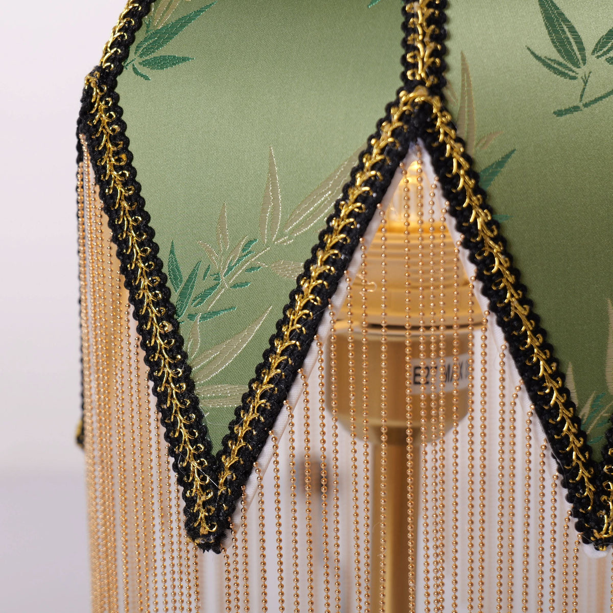 mid-century tassel table lamp with a warm diffused glow