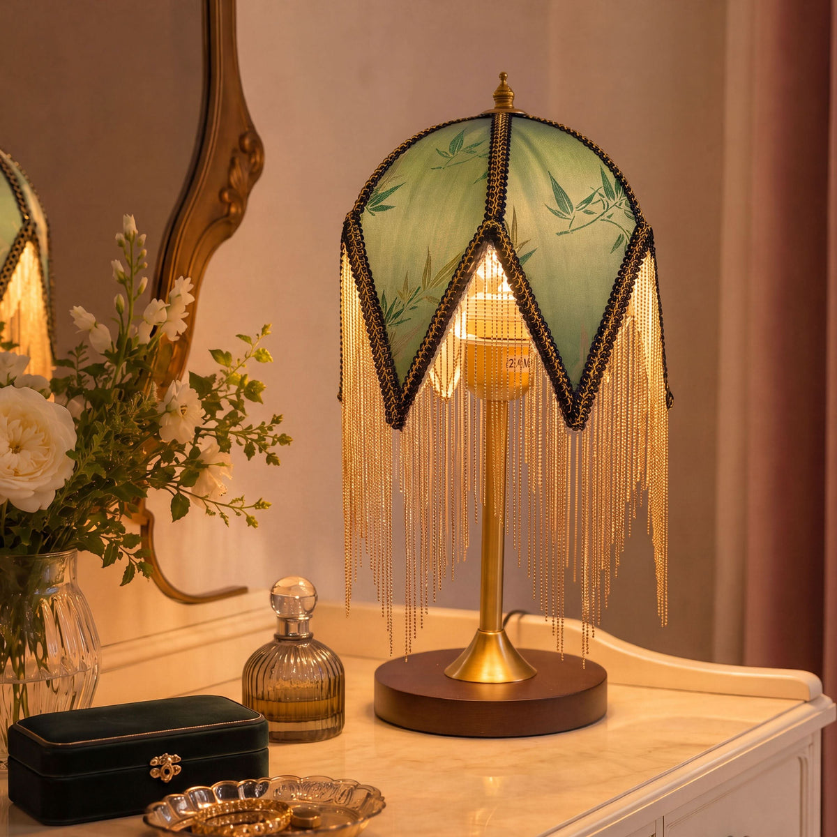 mid-century tassel table lamp glowing on a bedside table