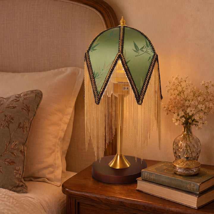 mid-century tassel table lamp adding warm light to a bedroom