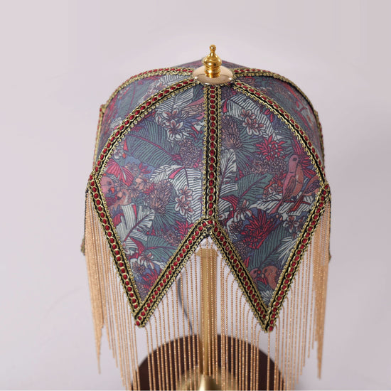 mid-century tassel table lamp styled on a small side table