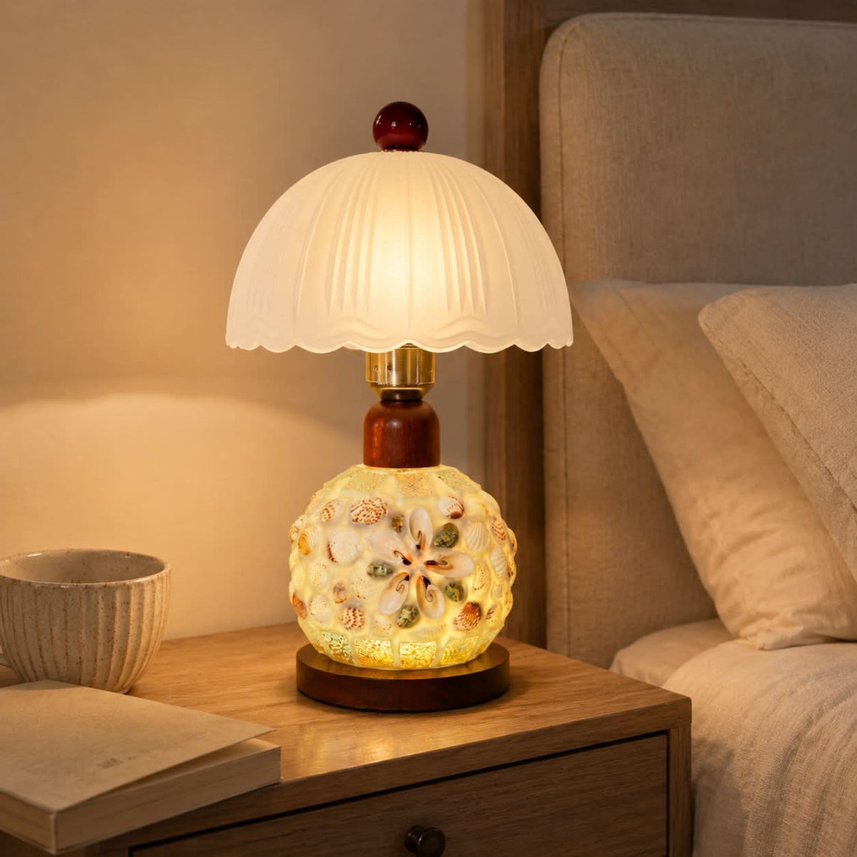 seashell mosaic table lamp shown as a clean product view