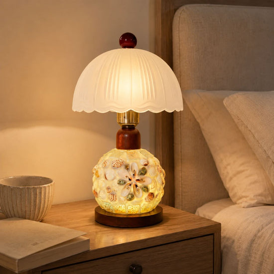 seashell mosaic table lamp shown as a clean product view