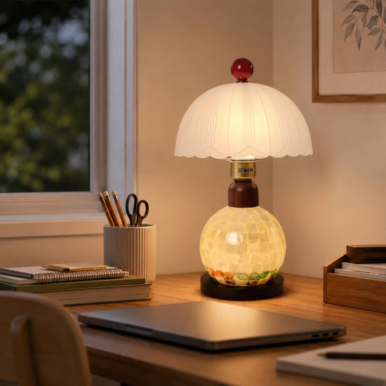 mother-of-pearl mosaic table lamp beside books and evening decor