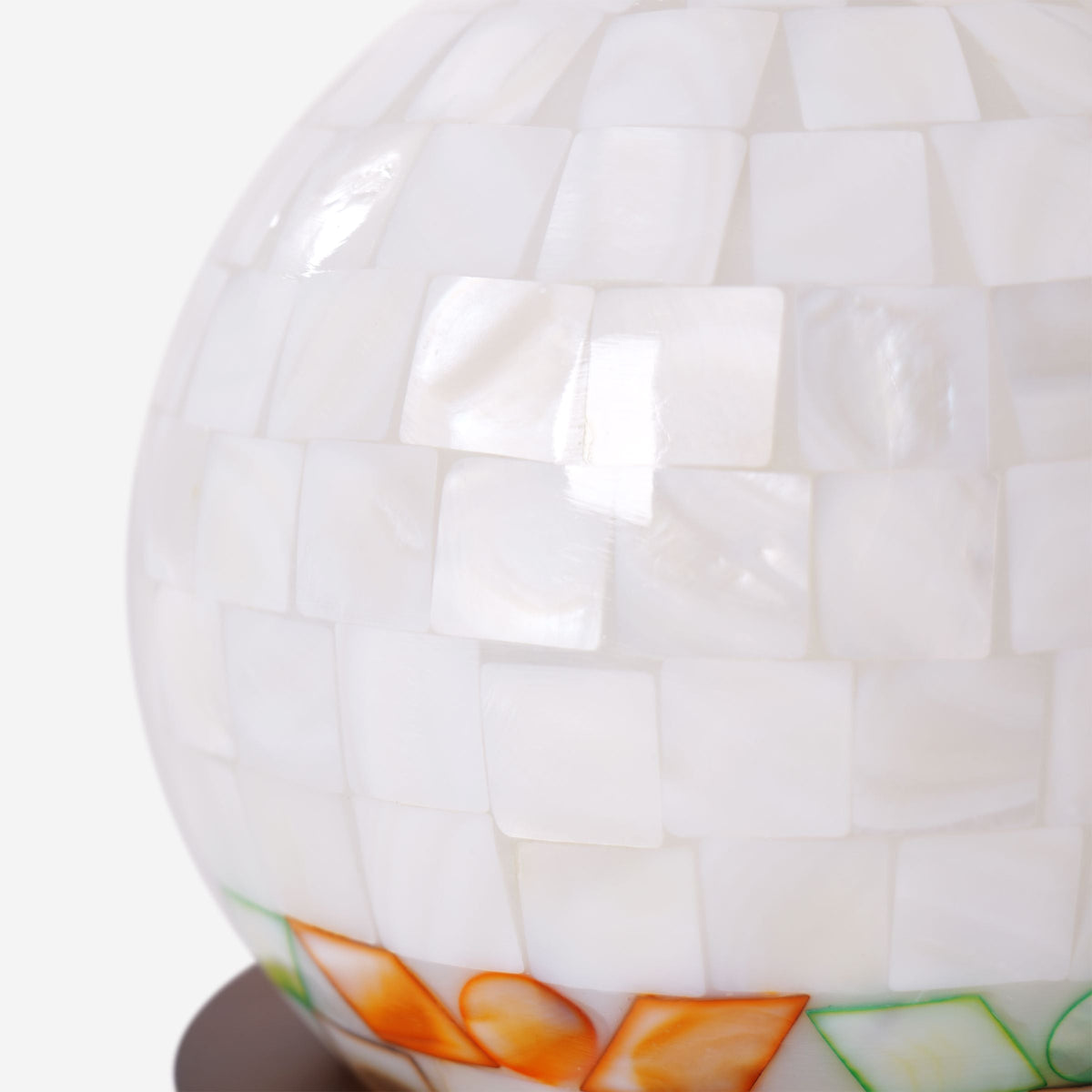 mother-of-pearl mosaic table lamp styled on a small side table