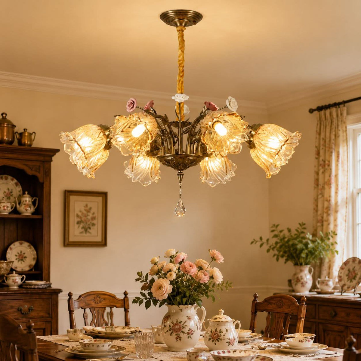antique bronze chandelier with amber flower shades glowing above a dining table