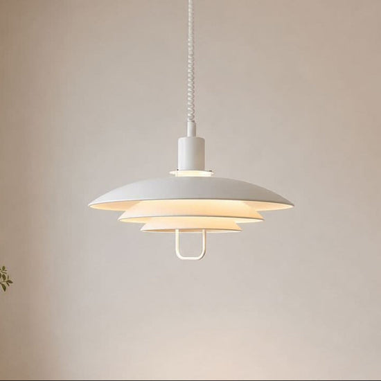 white layered minimalist pendant light over a kitchen island