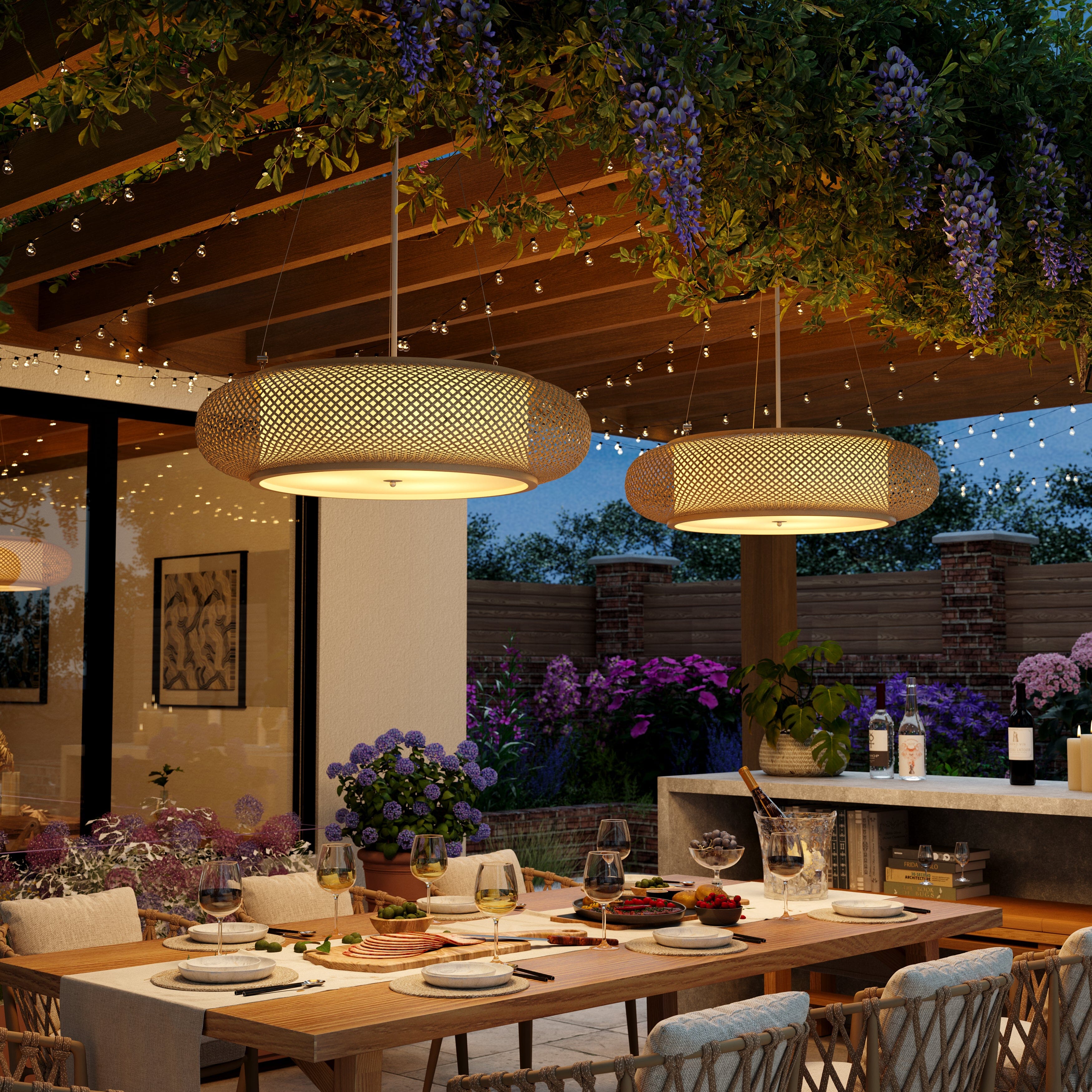 pair of bamboo pendant lights over an evening patio table