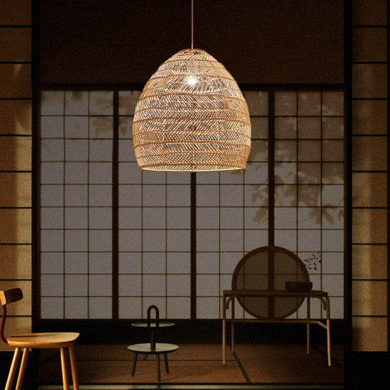 Rattan pendant light glowing in a calm Japanese-style room