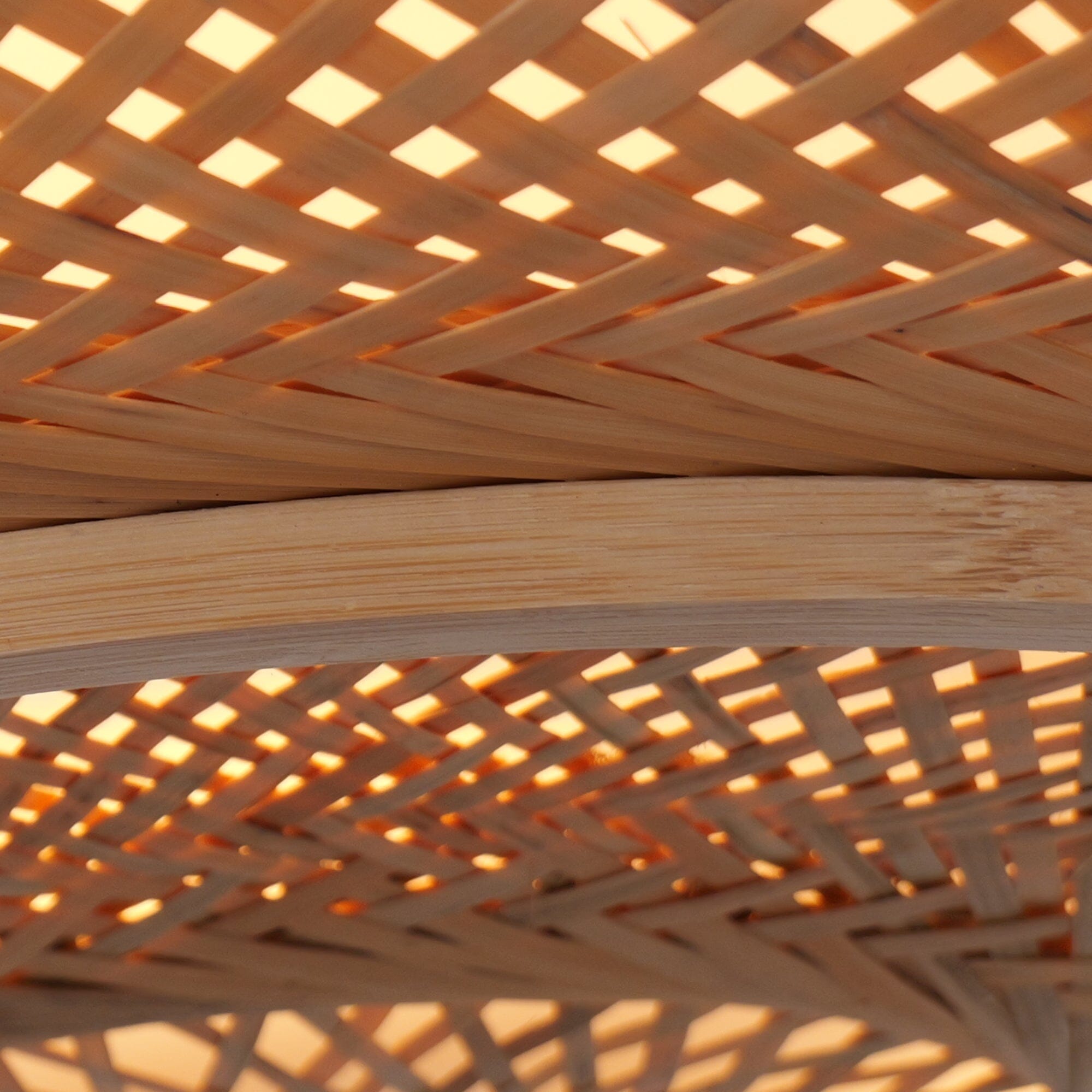 close-up of bamboo weave with warm light glow