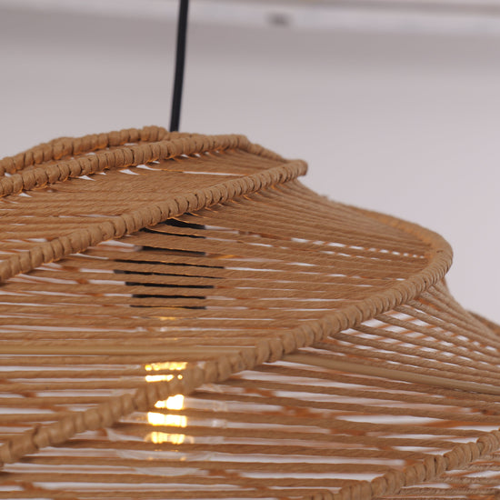 natural woven rattan pendant light close-up showing layered spiral shade
