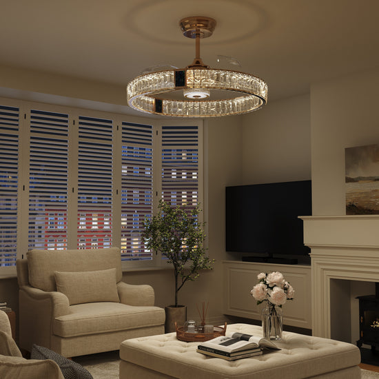 Elegant gold ceiling fan with crystal light fitted in a home interior